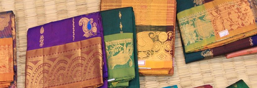 Kanchipuram silk sarees displayed in a boutique