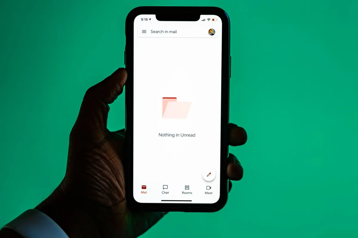 Hand holding a smartphone showing an app
