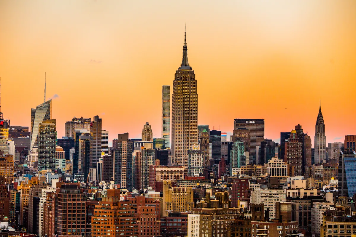 Manhattan skyline at sunset; SpikeSecure serves US clients remotely from India